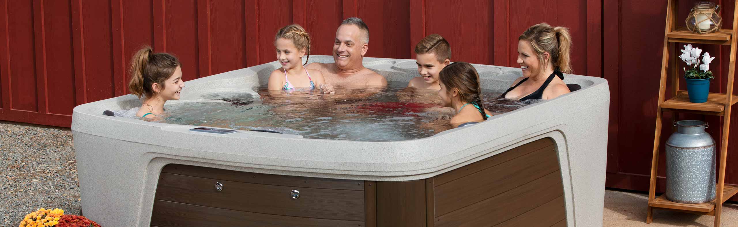 family enjoying a hot tub