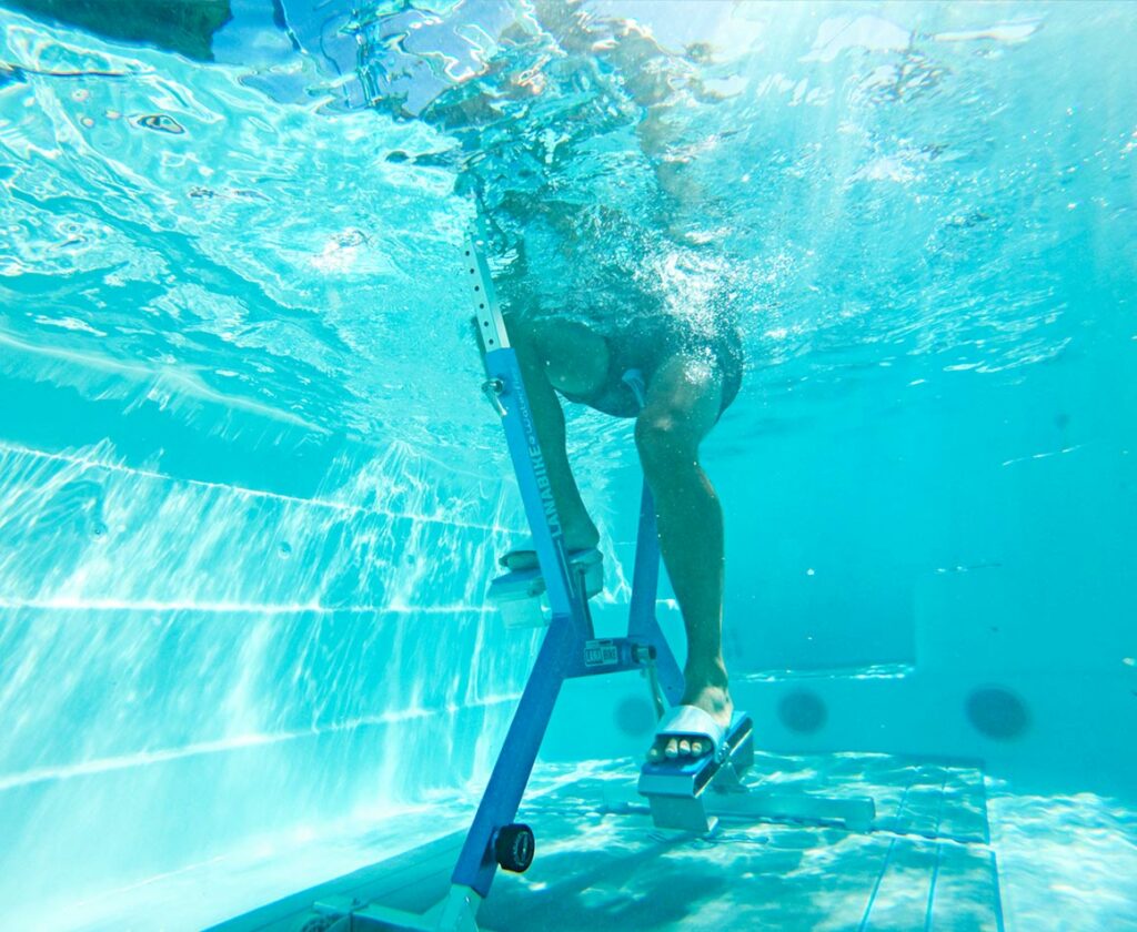 person using aquabike in a swim spa
