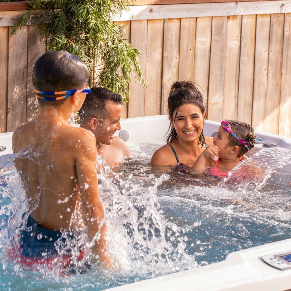 family enjoying a swim spa
