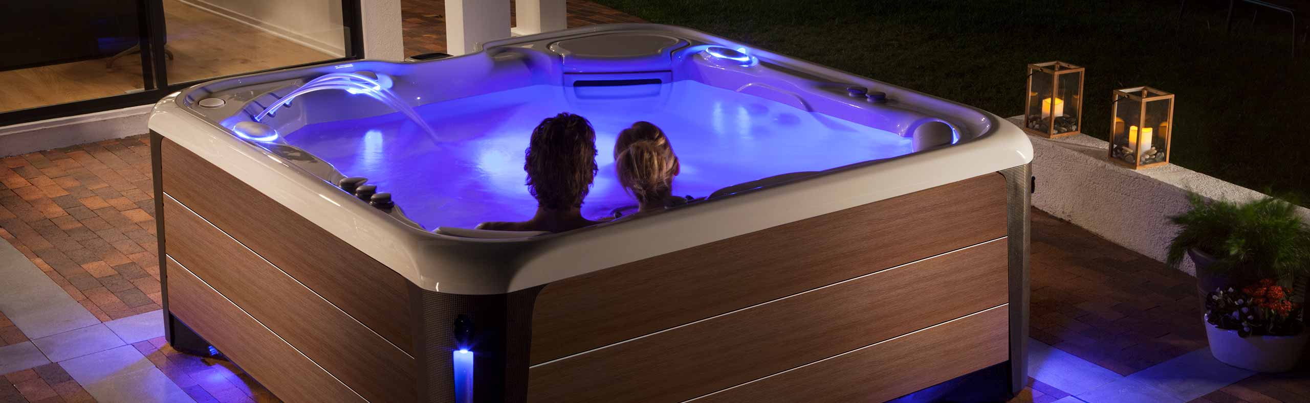 couple in a hot tub at night