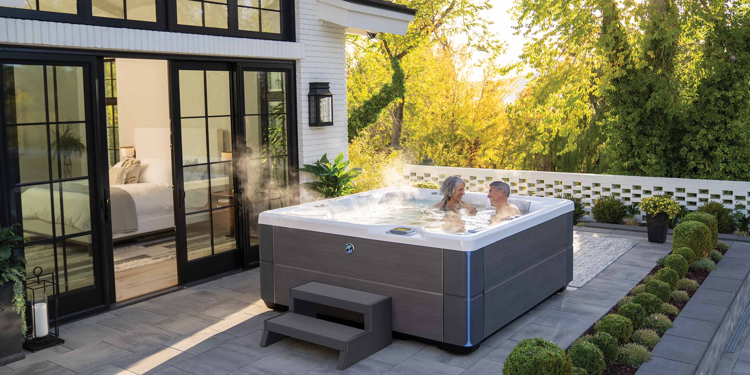 couple in a hot tub on their patio